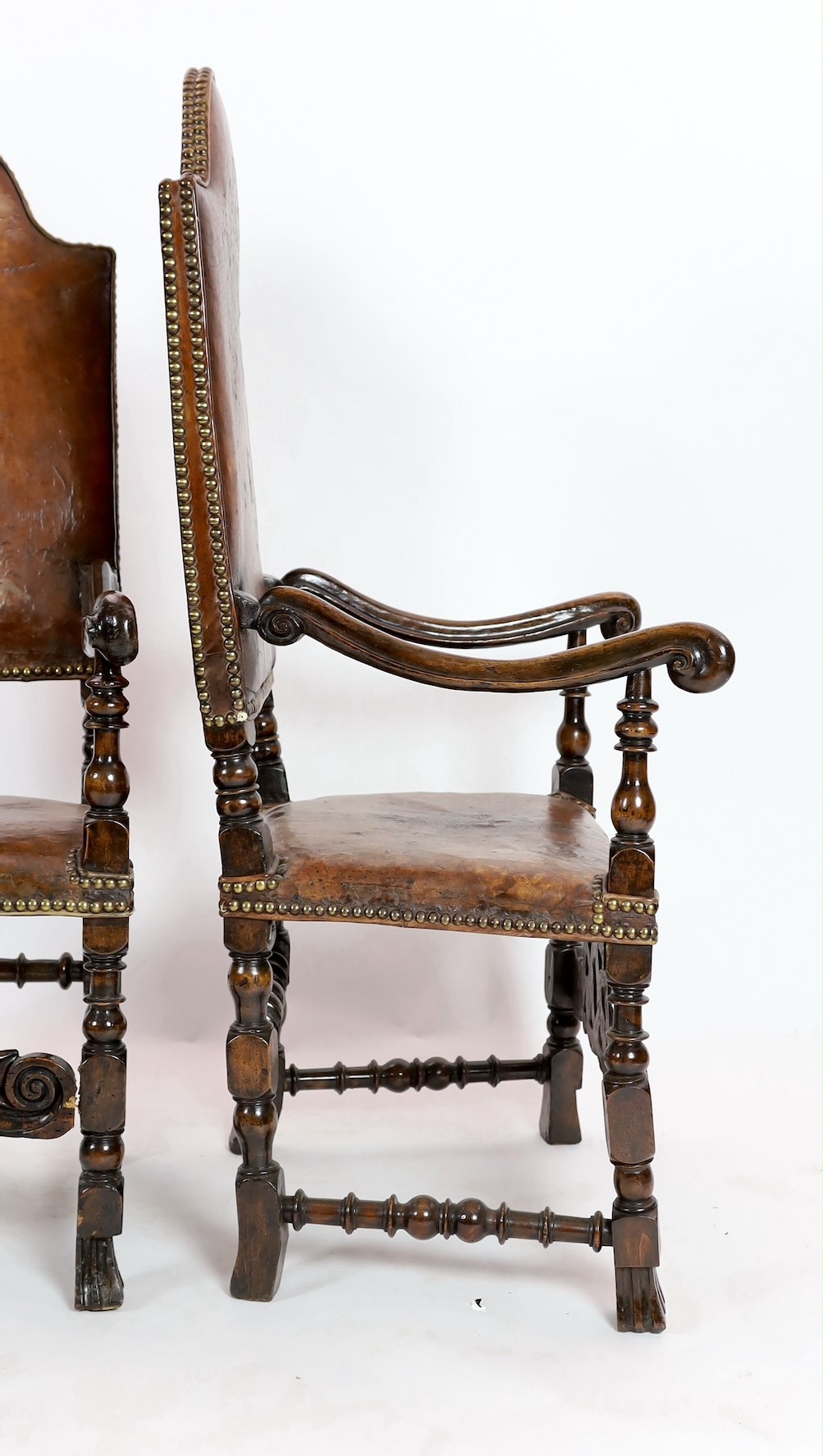 A pair of late 17th century Spanish walnut and elm armchairs